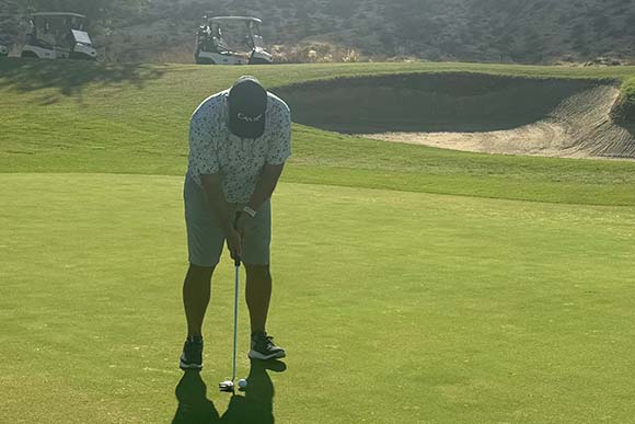 cam-employee-playing-golf